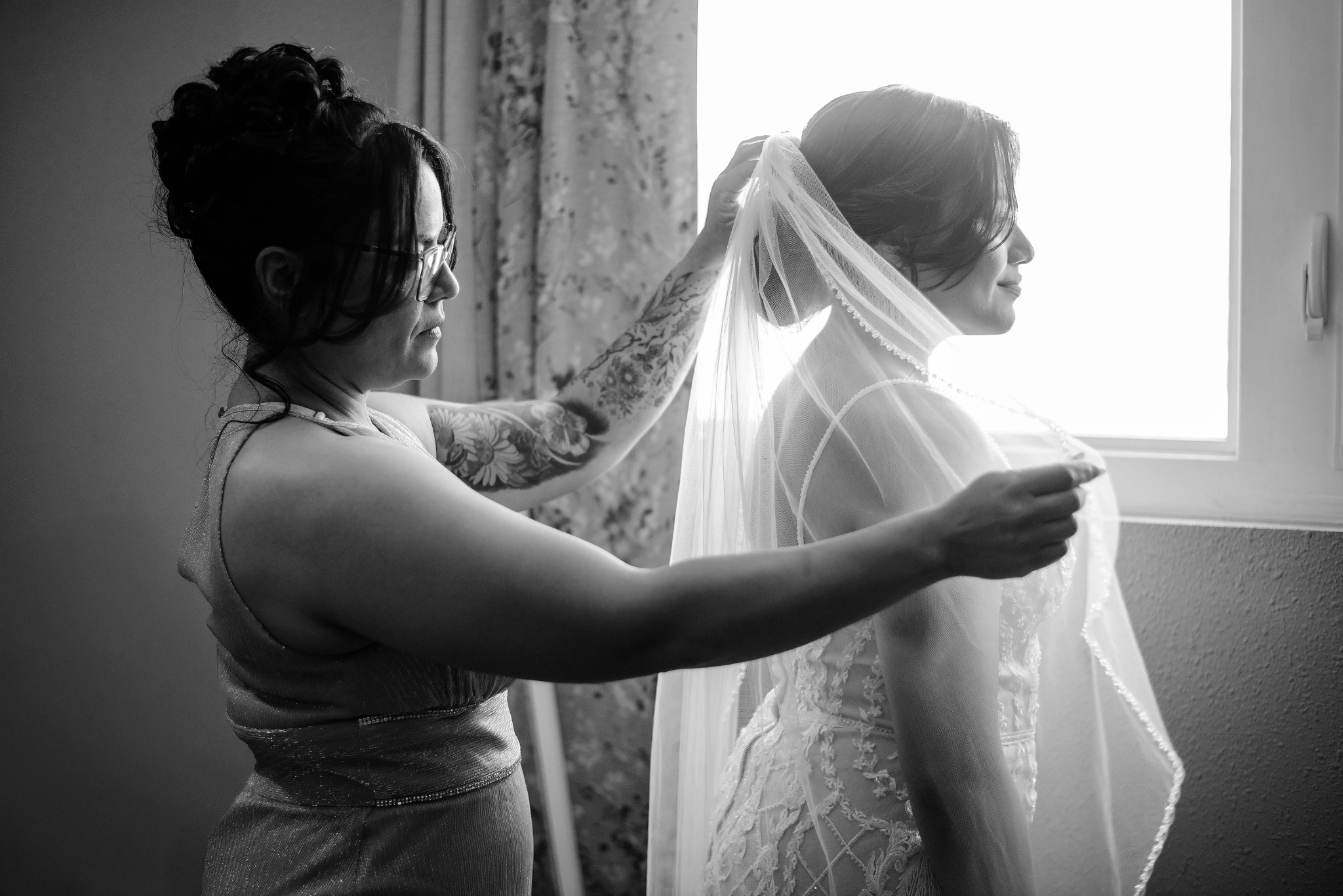 Bride having her veil placed before an El Paso wedding